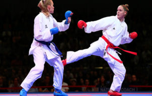 BREMEN, GERMANY - NOVEMBER 08:  Gitte Brunstad(L) of Norway fights against Alizee Agier of France during their women's gold medal bout in the under 68 kg category at the Karate world championships at OVB-Arena on November 8, 2014 in Bremen, Germany.  (Photo by Martin Rose/Bongarts/Getty Images)